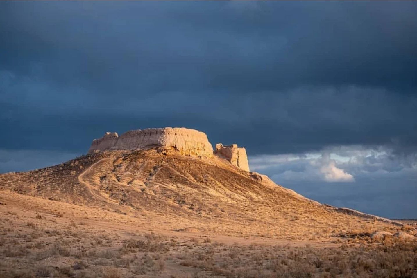 Toprak Kala fortress under stormy sky